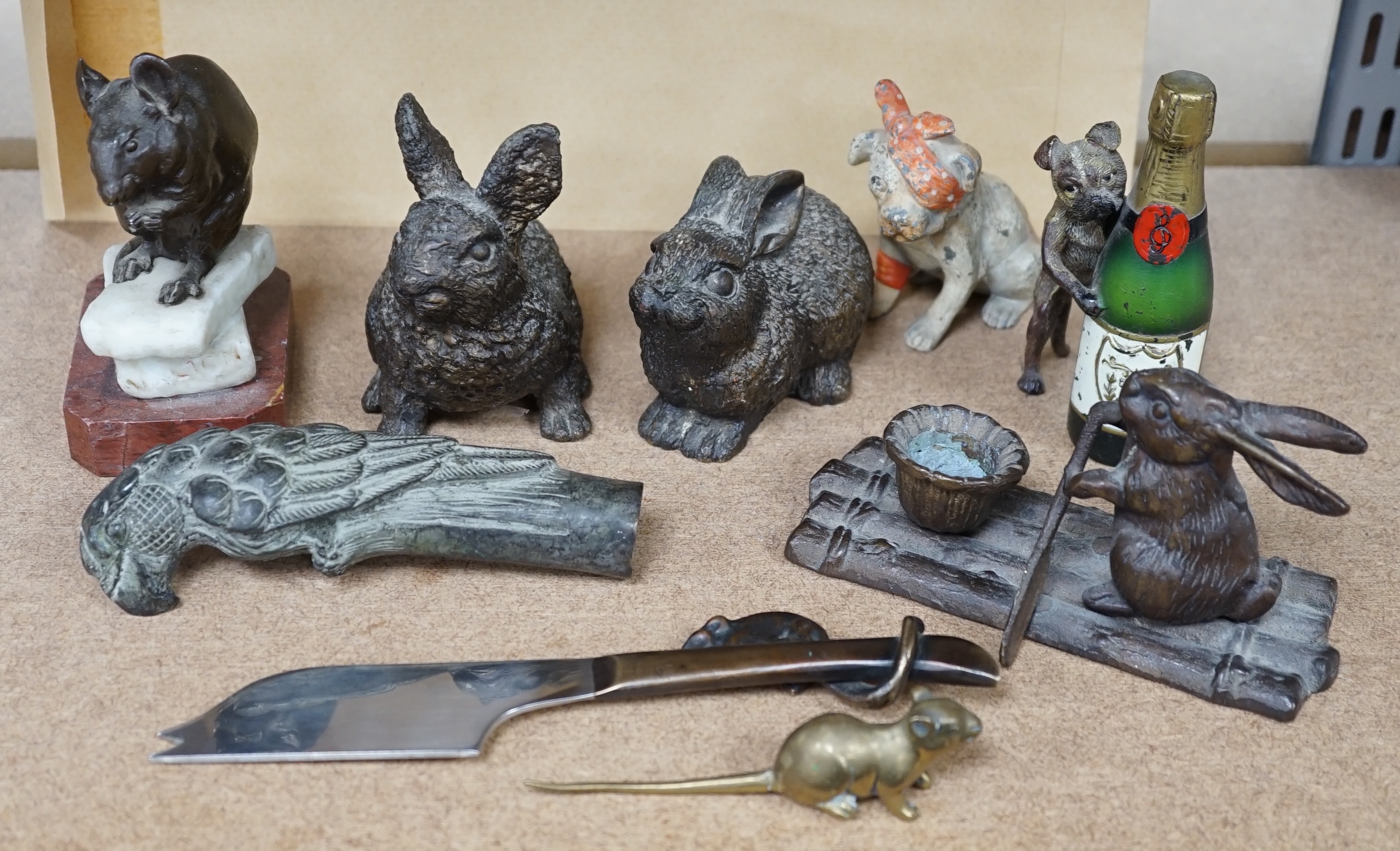 A collection of mixed metal novelty animal ornaments, walking stick handles, etc. of mice, dogs and rabbits, largest 13cm high (9). Condition - fair